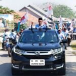 Pasukan Biru Mengaung!!!  Ribuan Masa Kawal Kampanye H. Jajang Sujai No Urut 1 Gaungkan Pilkades Damai